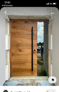 a man standing in front of a wooden door