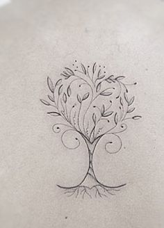 a tree tattoo on the back of a woman's neck