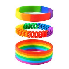 three different colored bracelets stacked on top of each other