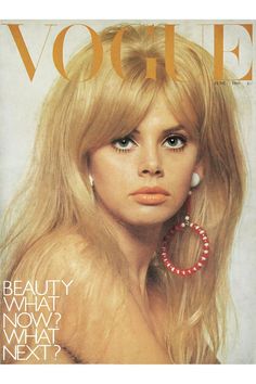 a woman with long blonde hair and large earrings on the cover of a magazine,