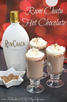 rum chata hot chocolate is served with whipped cream and cinnamon sprinkles