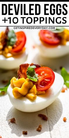 deviled eggs topped with bacon, tomatoes and lettuce on a white plate