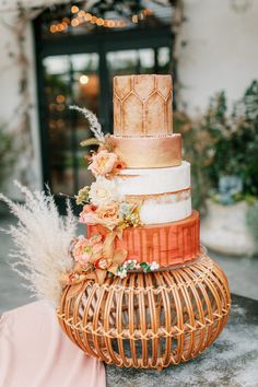 a multi layer cake sitting on top of a table