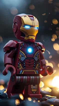 a lego iron man standing in front of a fire with glowing lights on it's face