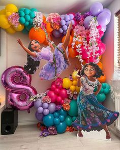 the balloon wall is decorated with princesses and balloons for her 6th birthday party at disney's hollywood studios