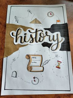 a piece of paper with the words history written on it and various things around it