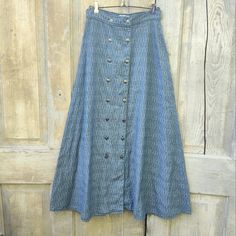 Vintage Long Chambray Denim Western Skirt From Calamity Jeans. Long, Floor Length Wrap Skirt That Buttons Down The Front. Flat ,Fitted High Waist. Silver Tone Southwestern Style Concho Buttons, The Tip Five Rows Button The Rest Are Decoration Only. V Shape Yoke Stitching On The Back. Unlined . No Pockets. Slubby Selvage Type Fabric. Perfect Reenactment Pioneer Prairie Old West Costume Piece. Well Made With No Noted Flaws. Made In The Usa 100% Cotton Size 6 Please See Measurements For Best Fit. Waist 13 1/2" Length 38" Vintage Retro Western Wear Rodeo Nfr Cowboy Cowgirl Denim Chambray Old West Prairie Pioneer Costume Unique Period Piece Movie Old West Costume, Period Piece Movies, Pioneer Costume, Costume Unique, Western Skirts, Period Piece, Jeans Long, Retro Western, Cowboy Cowgirl