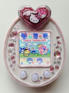 an electronic device with hello kitty characters on it