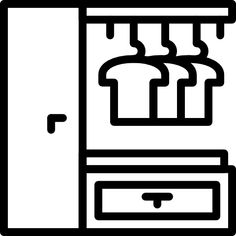 a black and white image of a refrigerator with clothes hanging on the rack in front of it