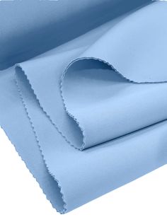 two sheets of light blue fabric folded on top of each other