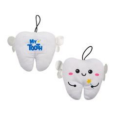 two tooth shaped ornaments with the words my tooth on them