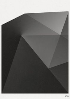 an abstract black and white photo with the shape of a triangular object on it's side