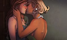 two women are embracing each other in front of a dark background, one is wearing a green dress and the other has blonde hair