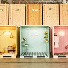 four different colored shipping containers in a warehouse with the words trove written on them