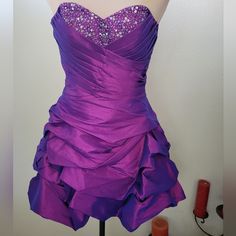 Jewel Tone Hoco Dress, Glow In The Dark Dresses, Tangled Homecoming Dress, Hoco Dress Purple, 2000s Homecoming Dress, Purple And Gold Quince, Dark Purple Hoco Dress, Purple Strapless Prom Dress, Dark Purple Homecoming Dress