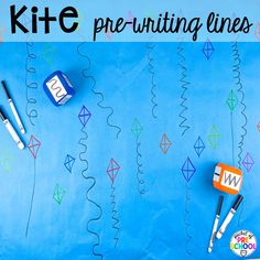 kite pre - writing lines on a blue background with markers and pens