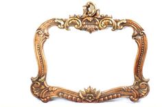 an ornate gold frame on a white background