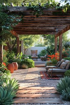 an outdoor patio with lots of plants and furniture