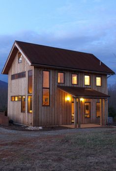 Exterior view of cabin from front Cabin With Porch, Front Door Modern, Black Metal Roof