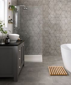 a bathroom with a tub, sink and shower in it's own design style