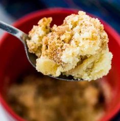 a close up of a spoon with some food in it