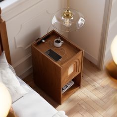 a small wooden table with a phone on it