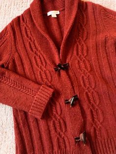 Coldwater Creek style and quality Shawl collar toggle cardigan Burnt orange tweed color Ribbed and Cable knit  Wool nylon blend Hand wash cold Ladies size Medium 10-12 Flat measure: Back neck to hem:  24" Sleeve 24" Armpit to armpit:  22 1/2" Great vintage condition.  Stored in my smoke free, pet free home Please read shop and shipping policies Shopping Clothes, Coldwater Creek, Shawl Collar, Wool Sweater, Online Shopping Clothes, Wool Sweaters, Burnt Orange, Cardigans For Women, Cable Knit