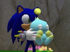 sonic the hedgehog is holding a toy in his hand