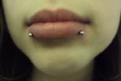 a woman with piercings on her nose