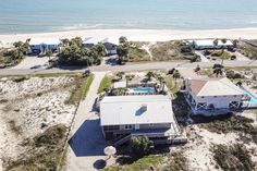 an aerial view of a beachfront home