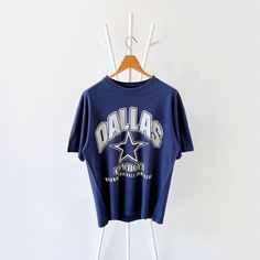 90s Dallas Cowboys NFL t-shirt/ L * PLEASE READ BEFORE PURCHASE * PLEASE consider the PHOTOS before making the decision * The images may DIFFER in appearance from the actual product because we took pictures under daylight.  * PLEASE send your PHONE NUMBER after your purchase for the shipping company to contact you X No returns X No refund Condition : 8/10 More details : look at the pictures  Brand :  Size : L Pit to pit/ Chests : 22/44 inches  Length : 28 inches  Material : cotton  Color : blue * ALL ITEMS are VINTAGE which may show some signs of wear and tear * Due to the different display and different light, the picture may not reflect the actual color of the item * Please, remember that our items are vintage so they may show some signs of wear, tear and yellow stains. Thank you RE/11/1 Vintage Dallas Cowboys Shirt, Dallas Cowboys Outfits, Dallas Cowboys Tshirts, Vintage Dallas Cowboys, Dallas Cowboys Shirts, Cowboys Nfl, Nfl T Shirts, Cowboys Shirt, Tshirt Outfits