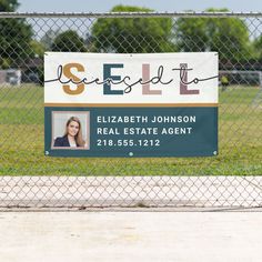 a real estate agent sign in front of a chain link fence with the words sell on it