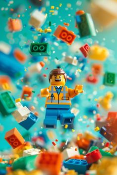 the lego man is surrounded by many different colored blocks and toys in the air with bubbles