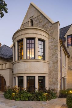 a large stone house with lots of windows