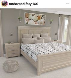 a bedroom with a bed, nightstands and pictures on the wall above it in neutral colors