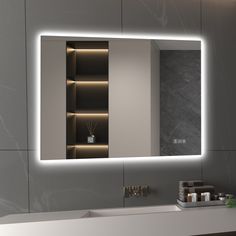 a bathroom with a sink, mirror and lights on the wall above it's cabinets