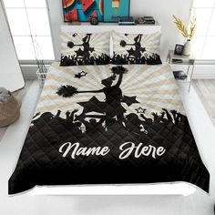 a black and white bed with an image of a person on it