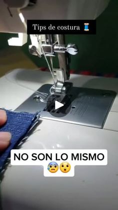 someone is using a sewing machine to sew on the blue cloth with emoticions