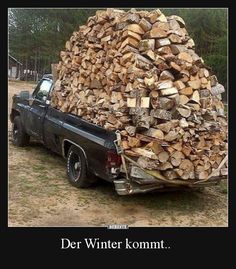 the truck is loaded with wood and ready to go