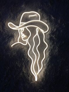 a white neon sign with a woman's head wearing a hat and long hair