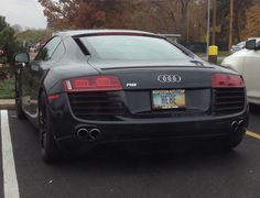 an audi car is parked in a parking lot