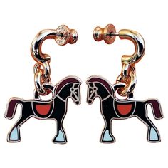 Cute and Beautiful Authentic Hermès Earrings In shape of horses Made of lacquered metal / rose gold plated finish (pinky gold) For pierced ears Colorway: "FAUBOURG" (pinky gold, coral orange saddle, burgundy mane and tail, white hooves) "HERMÈS", hallmarks and serial number engaved at back of each earring "HERMÈS PARIS -H- Made in France" engraved on each clasp Measurements: - Total height: 3,1 cm - Each horse is 2,2 cm at longest / 2 cm at highest Condition: New Condition. Never used. Would make a great gift ! Will come in their original Hermès box with dustbag and booklet These earrings are garanteed authentic and will be shipped immediately Thank you for watching my items ! Prince Rainier, Horse Earrings, Mane N Tail, Hermes Box, Hermes Paris, Coral Orange, Rose Earrings, Rose Gold Earrings, Pierced Ears