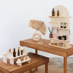 a wooden table topped with bottles and containers