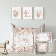 a baby's room with pink and white decor