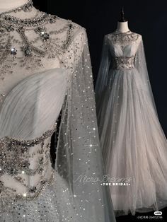 a white dress with silver sequins on it and a long sleeved gown