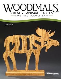 the book cover for woodimals creative animal puzzles for the scroll saw