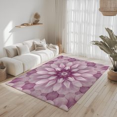 a living room filled with furniture and a large flower rug