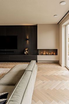 a living room with a couch, fireplace and sliding glass doors