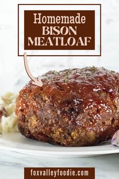 a meatloaf recipe on a plate with the words homemade bison meatloaf above it