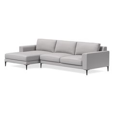 a gray couch sitting on top of a white floor